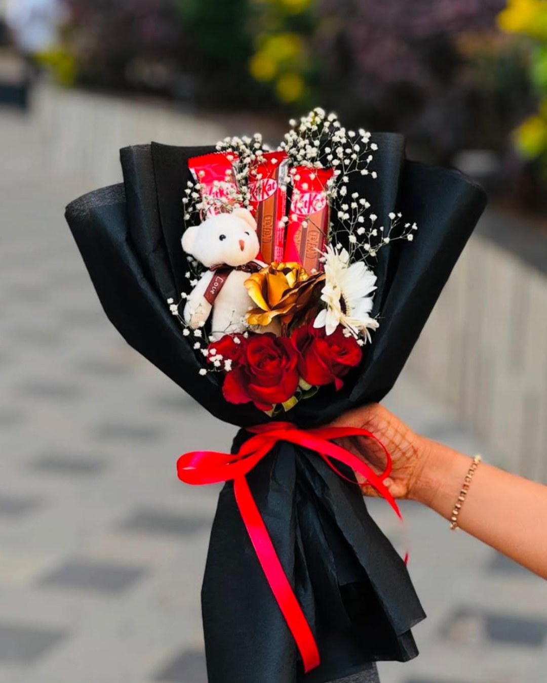 Teddy and KitKat combo bouquet wrapped in black paper