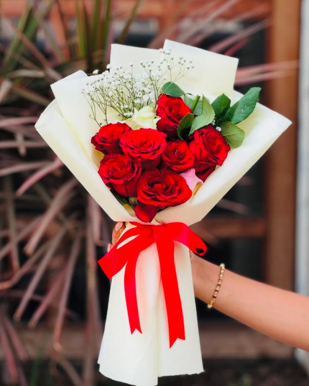 Fresh red roses arranged in an elegant bouquet